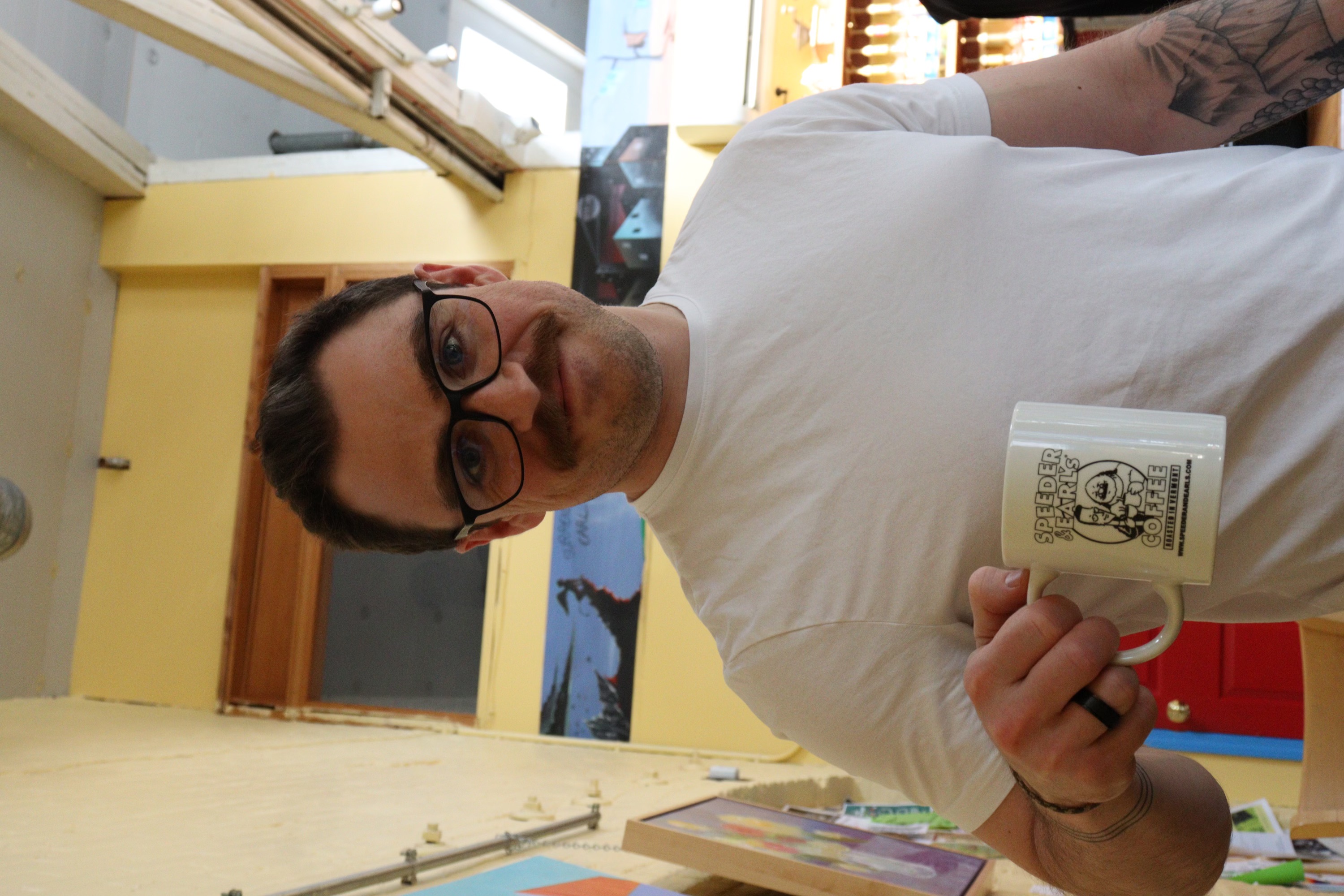 Derek MacDonald holding a coffee mug